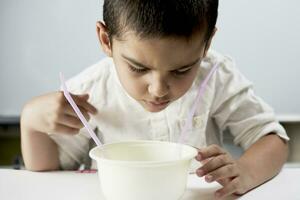 Schoolboy conducting scientific experiments photo