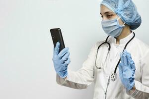 Female doctor during break time. Nurse talking with family via zoom videocall photo