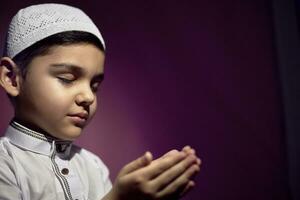 Praying muslim boy photo