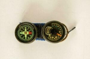 two compasses on a white background photo