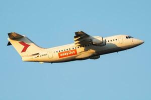 EasyJet British Aerospace Avro RJ100 D-AMGL passenger plane departure and take off at Vienna Airport photo