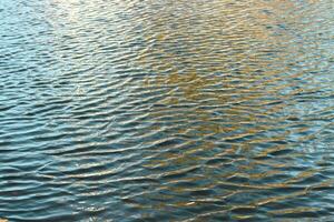 river surface texture, waves shining in the sun. photo