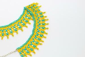 Beaded neck ornament, traditional ethnic silyanka, in yellow-blue colors photo