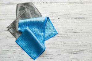 Blue and gray cloth with a special texture for cleaning glasses and dishes for household cleaning. photo