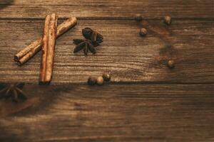 Cinnamon, sweet peas, spices for a hot drink photo