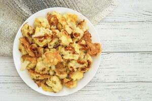 Vegetables Cauliflower fried in egg and flour batter photo