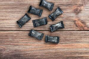 nicotine pouches tobacco, black snus on the background photo