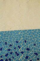 a mosaic tile pattern on the floor of a pool photo