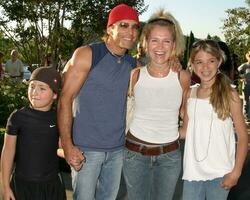 Scott and Melissa Reeves son Larry and daughter Emily belle gray Boutique Opening Calabasas CA June 30 2005 photo