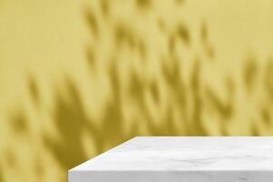 Minimal White Marble Table Corner with Light Beam, Shadow, and Spotlight on Gold Concrete Wall Background, Suitable for Product Presentation Backdrop, Display, and Mock up. photo