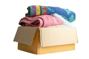 Donation box with used clothes isolated on white background with clipping path to support help for poor people in the world. photo