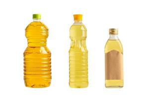 Vegetable oil with olive oil in different bottle for cooking isolated on white background. photo