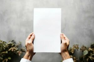 Hand holding white blank paper sheet mockup, isolated. Arm in shirt hold clear brochure template mock up. Leaflet document surface design. Simple pure print display show. generative ai. photo