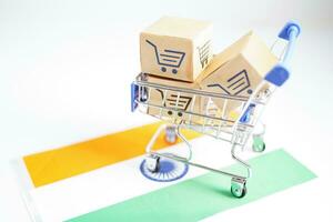 Online shopping, Shopping cart box on India flag, import export, finance commerce. photo