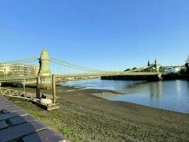 A view of the River Thames at Hammersmith showing the bridge photo