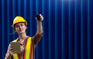 Female foreman is using walkie talkie photo