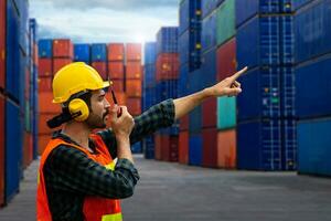 industrial worker is controlling container loading in import-export business. photo