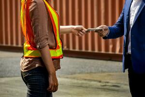 The supervisor pays wages to employees photo