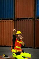 industrial worker is controlling container loading in import-export business. photo