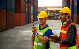 Two industrial workers are discussing the job plan photo