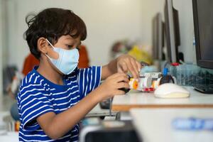 Boy wear face masks to prevent the Coronavirus 2019 COVID-19 in schools. photo