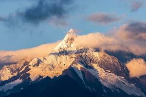 A landscape of the Meili Snow Mountains during the sunrise in Deqin, China photo