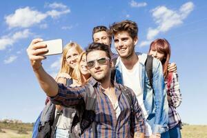 group of friends taking a self portrait photo