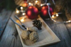 christmas decorations lights and dried fruit over a wooden table photo