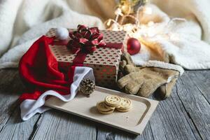 christmas decoration lights and three cookies on wooden table photo