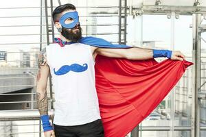 young hipster superhero fights evil photo