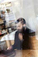 young hipster businessman on break for a coffee photo