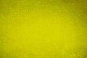 golden velvet fabric texture used as background. blond color panne fabric background of soft and smooth textile material. crushed velvet .luxury yellow tone for silk.. photo