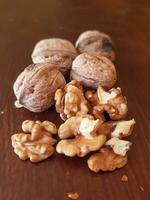 Exploration of the walnut landscape at the table of shelled and unshelled walnuts photo