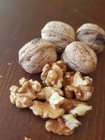 Walnuts in their shells and without them photo