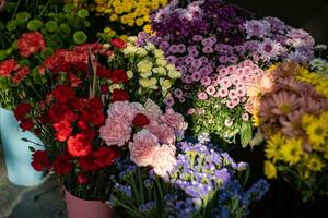 Variety of autumnal flowers in the street market photo