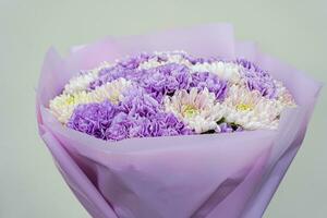 Pale purple flowers in bouquet photo