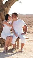 happy young couple kissing and hugging photo