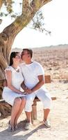 happy young couple kissing and hugging photo