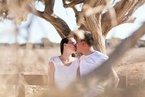 happy young couple kissing and hugging photo