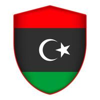 Libya flag in shield shape. Vector illustration.