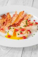 Poached eggs with bacon photo