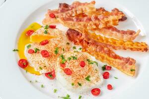 Poached eggs with bacon photo