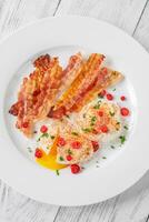 Poached eggs with bacon photo