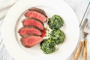 Flank steak with creamy spinach photo