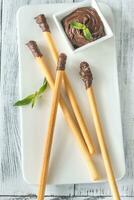Breadsticks with chocolate cream photo