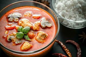 Thai red chicken curry with white rice photo