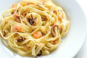 Tagliatelle pasta with seafood photo