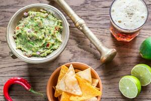 Guacamole with tortilla chips photo