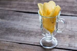 Potato chips in the glass photo