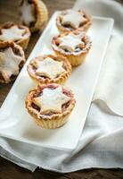 Mince pies with Christmas tree branch photo